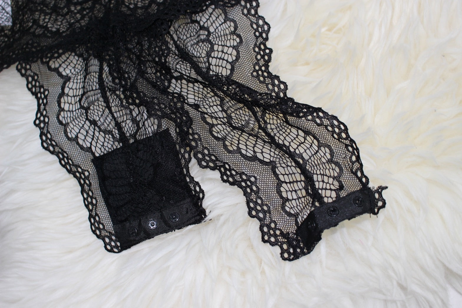 see-through body suit.